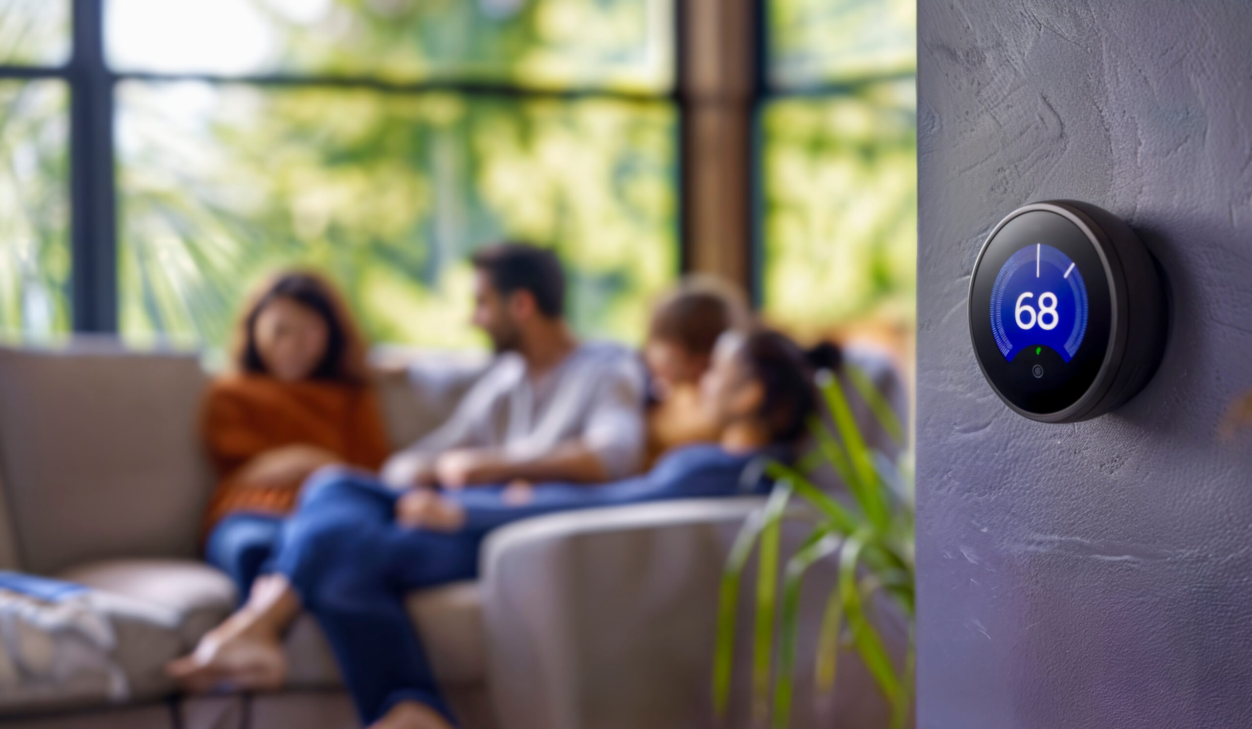 a family peacefully enjoys their home because of ideal thermostat settings