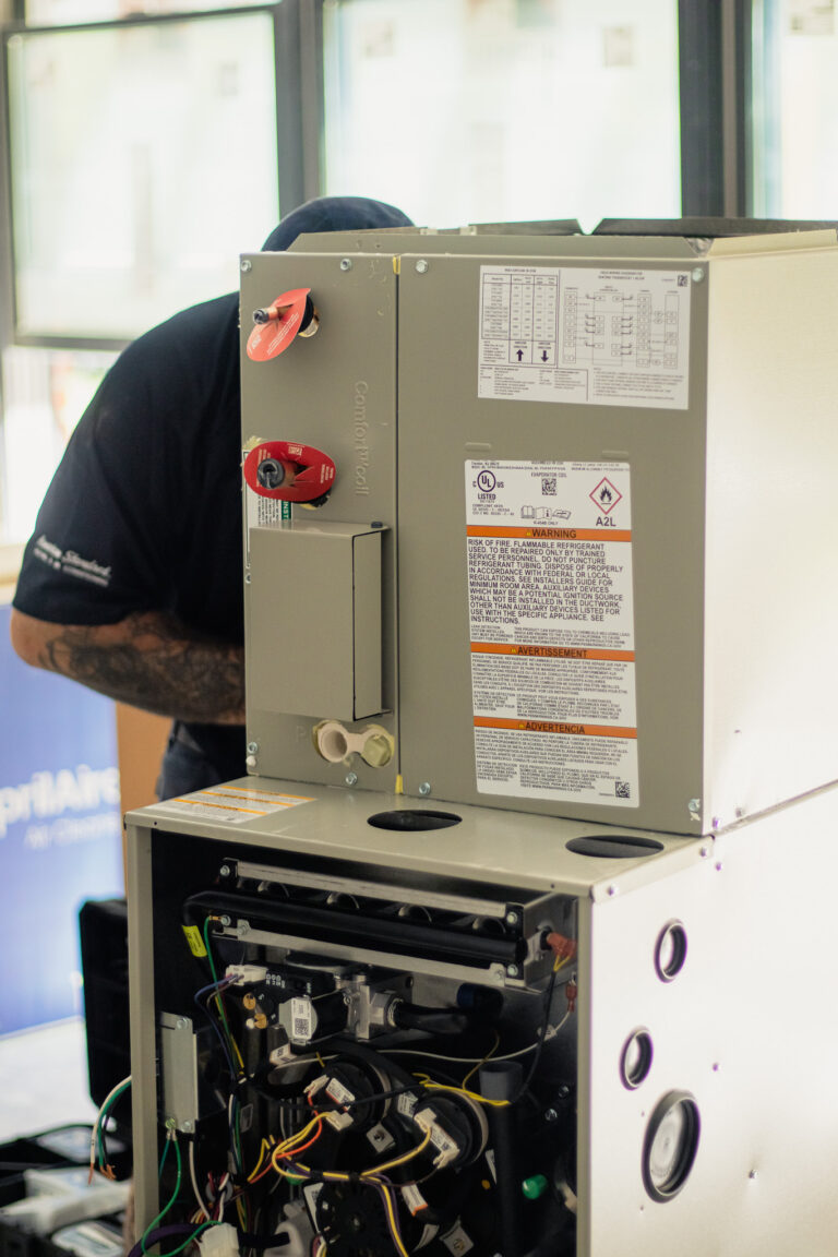 technician-fixing-air-conditioner