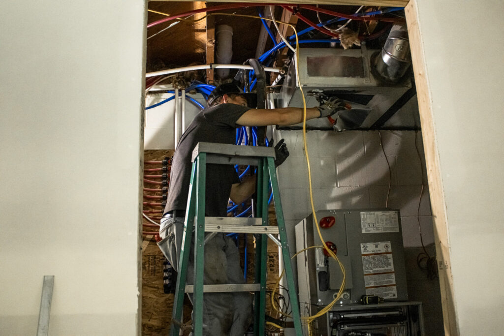 HVAC technician installing residential heating unit